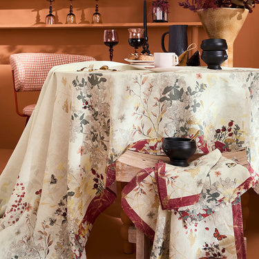 Garnier-Thiebaut ‘Vintage Flowers Cranberry’ tablecloth all-over pattern features butterflies dancing around delicate florals Shown on a set table display