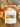 Packaged product labeled 'Autumn Harvest' with decorative elements on a wooden surface