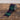 Ragon House Tartan Ribbon on Spool. Ribbon is Navy Blue/Green/Red/White tartan