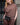 Mersea Frenchie Dolman Neck Top in Espresso. Model has paired it with similar colored pants and a little purse