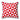 Red and white geometric patterned pillow on a white background