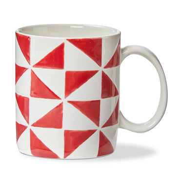 Mug with red and white geometric pattern on a white background