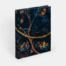Decorative book with artistic cover design on a white background.