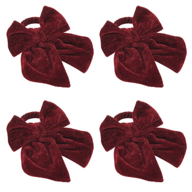 Four identical deep burgundy velvet bow napkin rings arranged in a 2x2 grid on a plain white background.