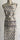 Patterned apron on a mannequin against a white background