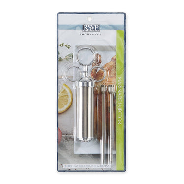 Marinade injector set in packaging with lemon and herbs on a white background