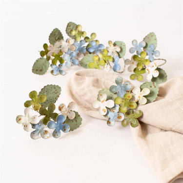 Audrey's Home & Gift - Dainty Metal Hydrangea Napkin Rings Shown with napkin
