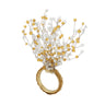 A gold ring featuring a dramatic, branching cluster of clear faceted beads and small amber-yellow beads on a plain white background.