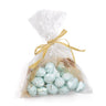 A clear plastic bag tied with a yellow ribbon, containing blue and white speckled eggs, likely representing Springhill Eggs.