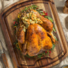 Cutting board showing a cooked turkey