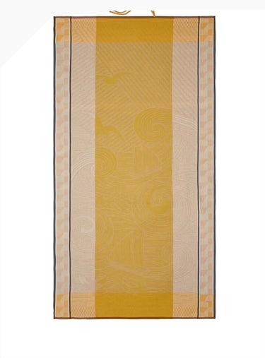 Yellow and beige checkered mat with a pattern on a white background