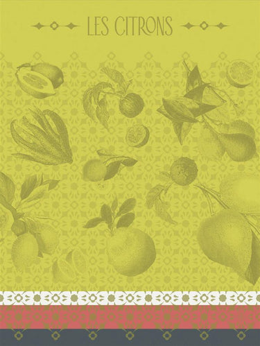 A rectangular tea towel featuring the words 'LES CITRONS' at the top, with scattered citrus fruit illustrations in a muted yellow-green palette. The design includes a patterned border along the bottom with white, pink, and dark gray sections.