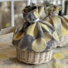 Wicker basket with cloth top in navy and cream lemon pattern