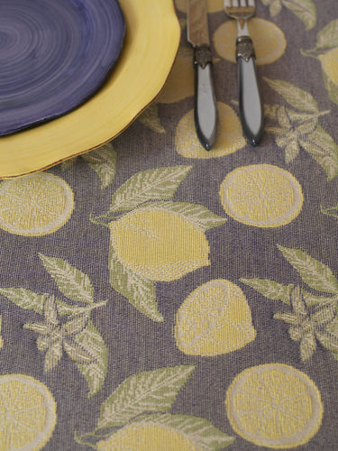 blue-grey placemat featuring a repeating yellow lemon print
