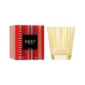 Nest New York Classic Holiday Candle and Package. Candle is in glass container with gold etched design. Package is red and gold with patterned stripes.