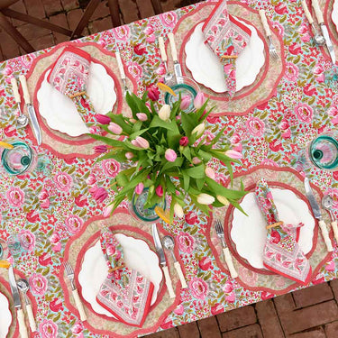 Pomegranate Wildflower Garden Collection Tablecloth shown on table with place setting. Also shown are the napkins from this same collection.