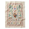 Rifle Paper Co. kitchen towel featuring vintage sewing sampler style