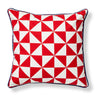 Red and white geometric patterned pillow on a white background