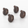 Four wooden bird-shaped napkin rings on a white background