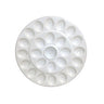 White ceramic plate with indents for deviled eggs.